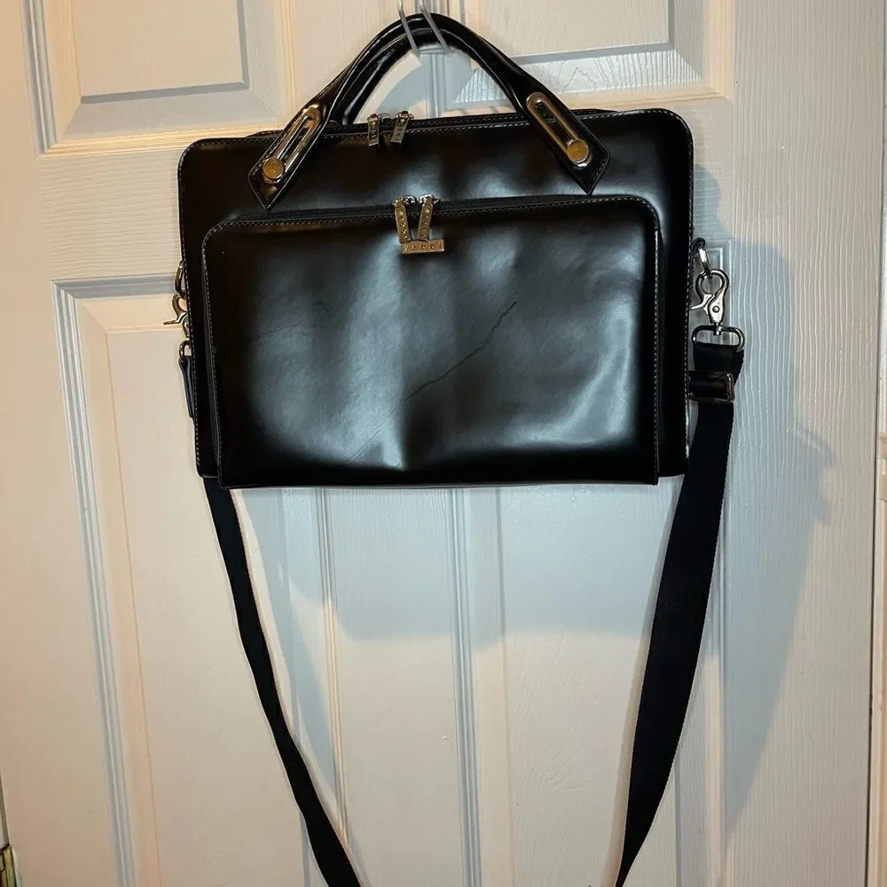 Abbi New York Laptop/Briefcase Carrier Black leather inside padded fabric.